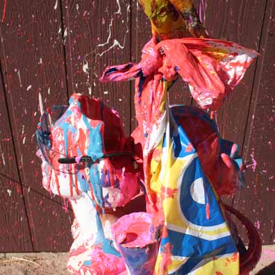 White and Black goddesses swathed in paint and YES signs.